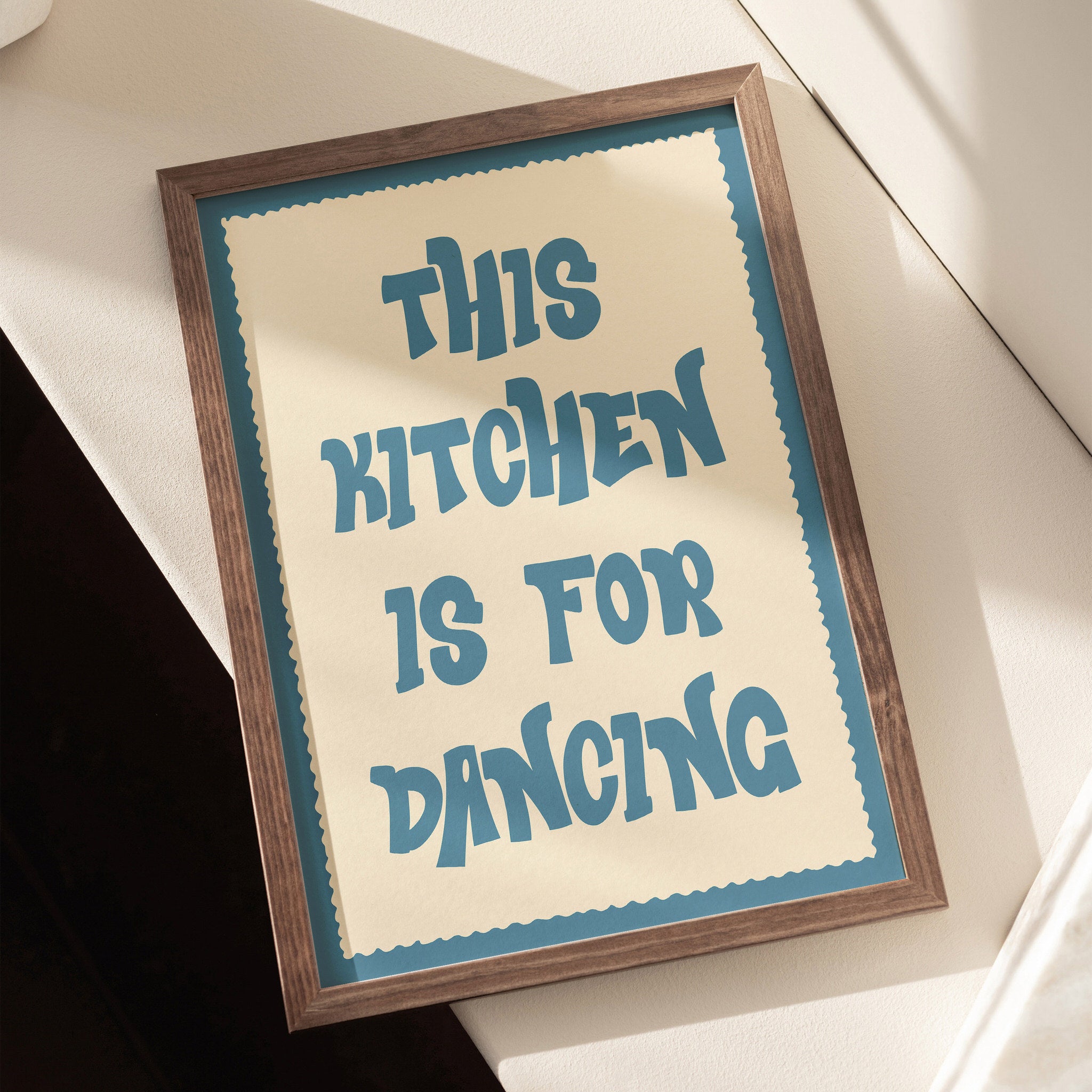 Playful kitchen poster featuring bold teal typography on a cream background